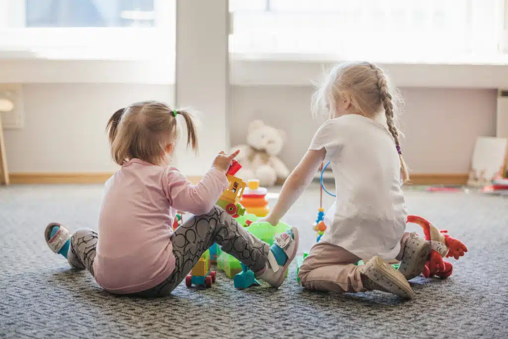 An image of two children playing with toys, representing the children that Dynamic Psychotherapy can help.