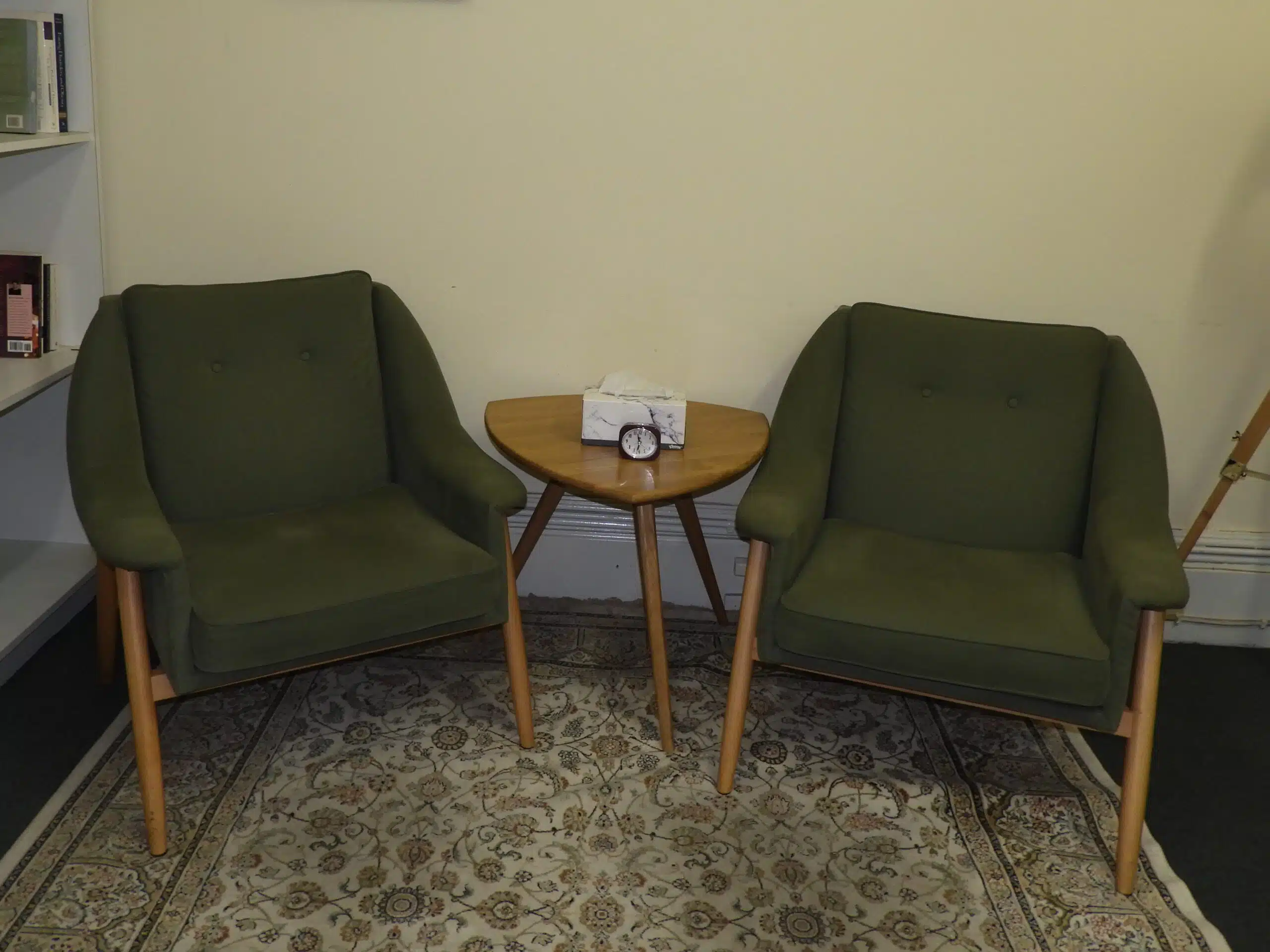 A picture of two green chairs, taken inside Dynamic Psychotherapy's Carlton, Melbourne Psychology Clinic